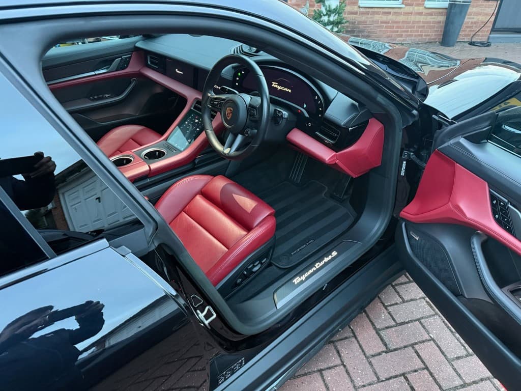 Porsche Taycan Turbo S interior — red leather deep cleaned, conditioned and finished